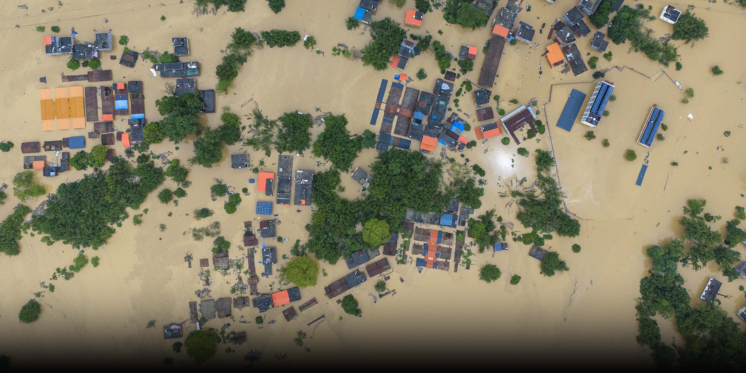 Towns Cut Off as ‘Once-in-a-Century’ Floods Engulf South China